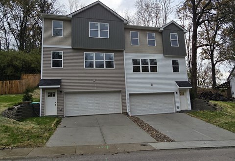 a with a garage and a driveway